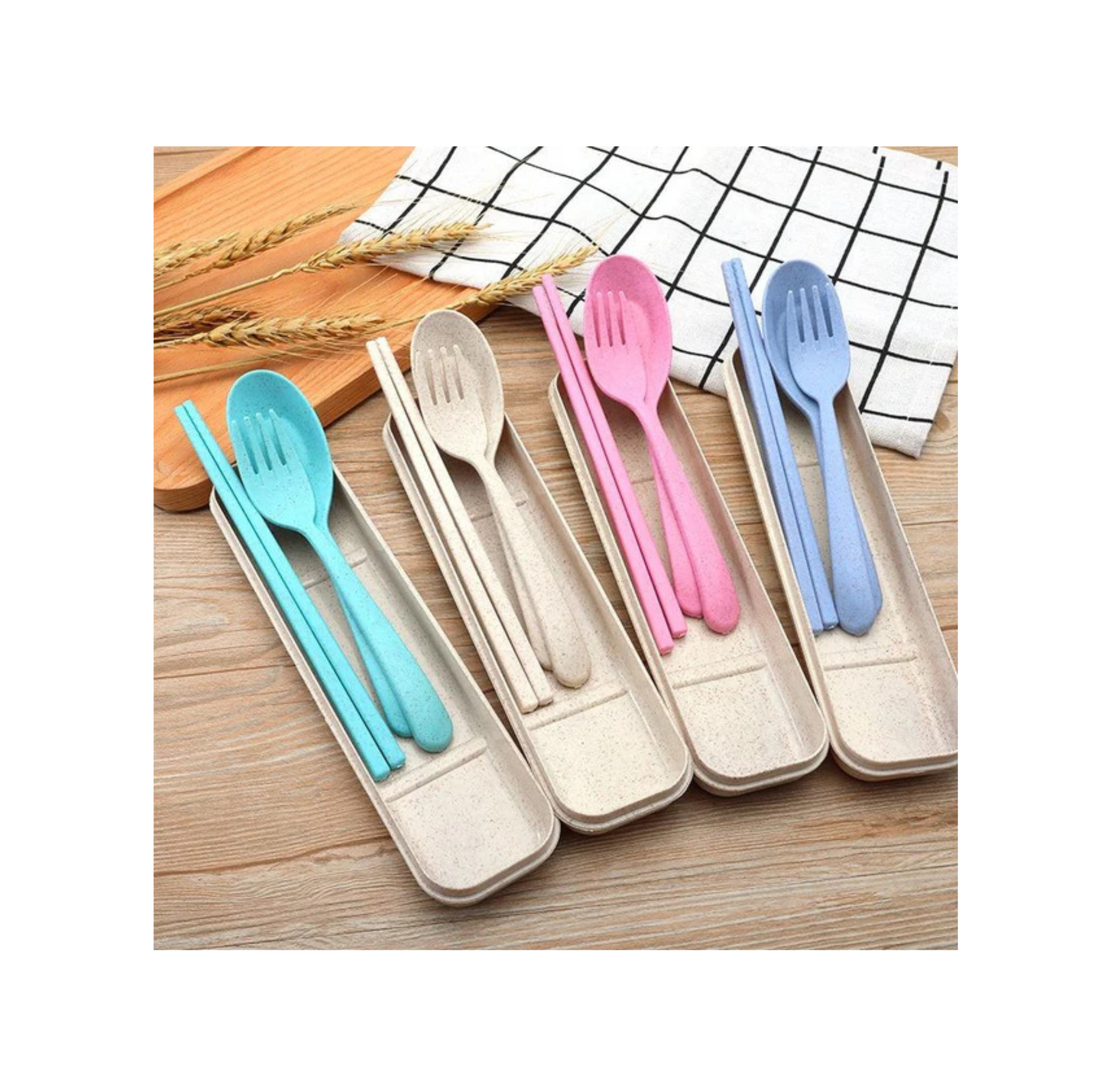 Set of colorful plastic cutlery in a holder on a wooden surface.