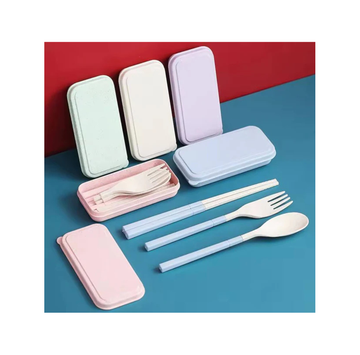Set of reusable cutlery in pastel cases on a blue surface with a red background